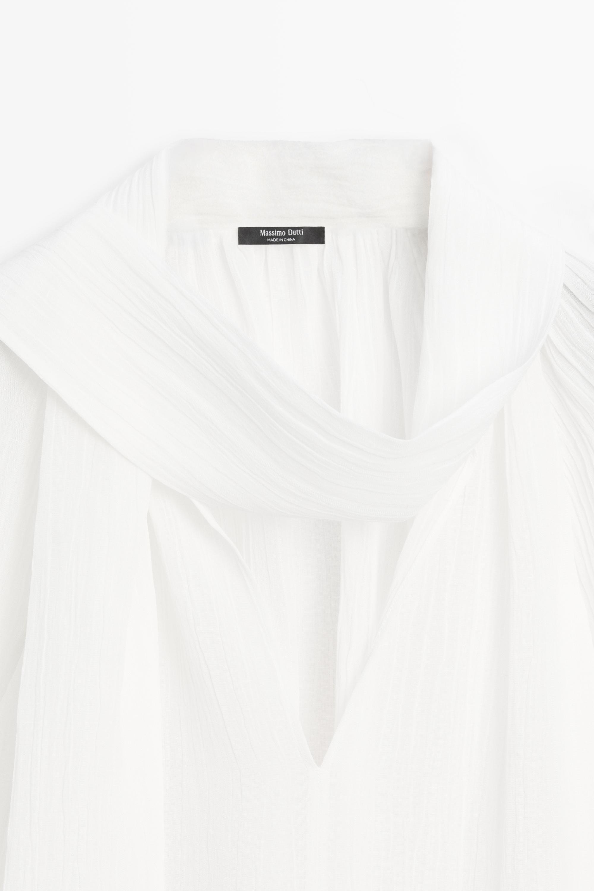 Blouse fluide col en V avec nœud